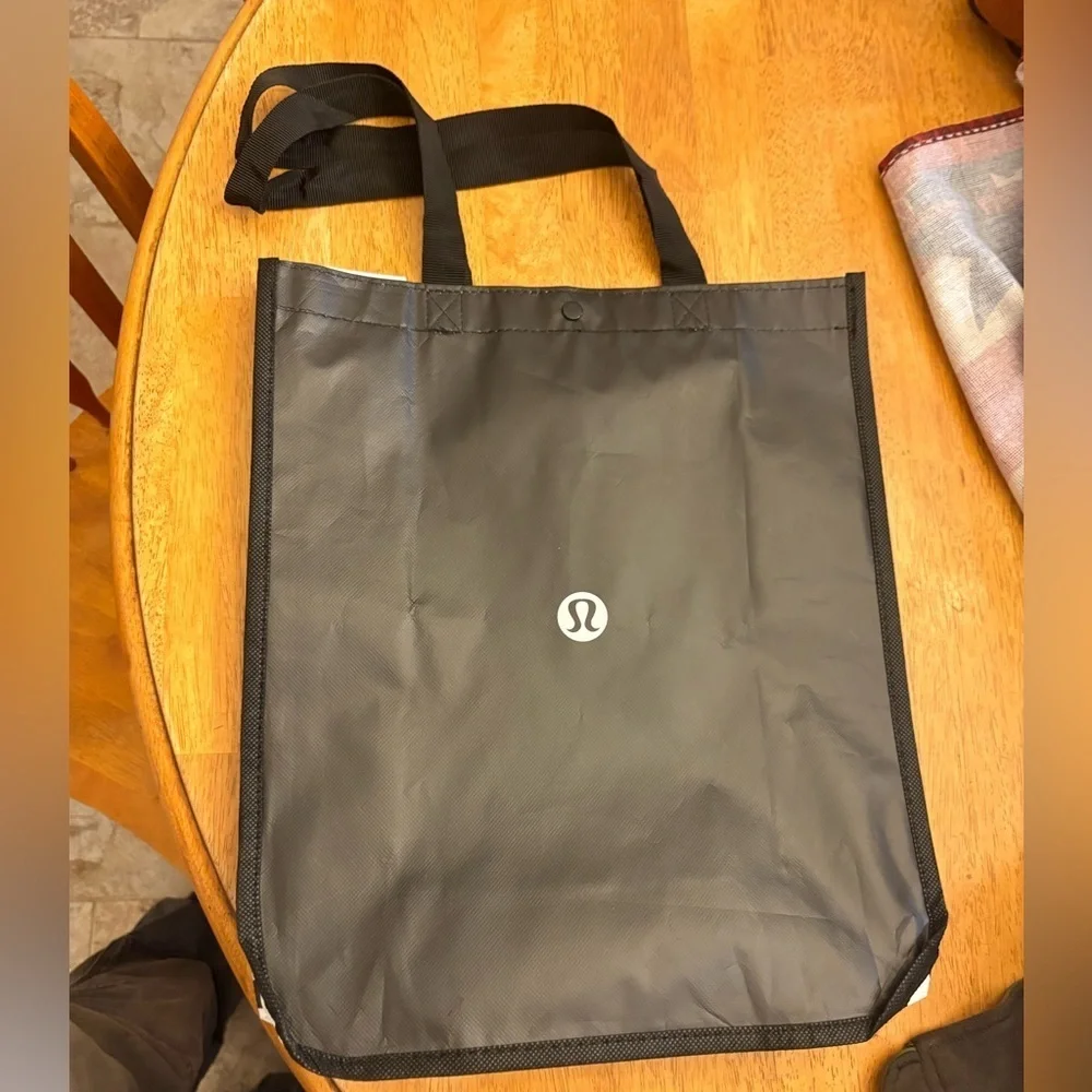 black lululemon shopping bag Reusable while grab handles and a shoulder strap give you carrying options. Women's Bags | lululemon